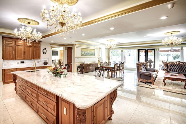 kitchen with a large island, sink, pendant lighting, and french doors