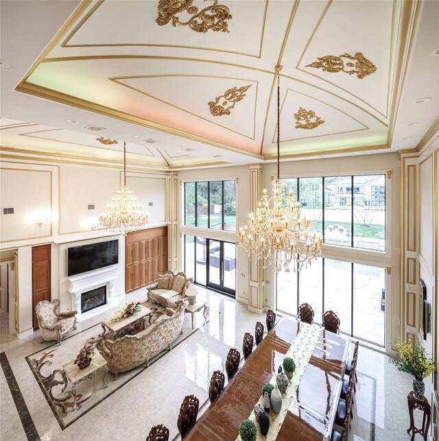 living room featuring crown molding, french doors, and a towering ceiling