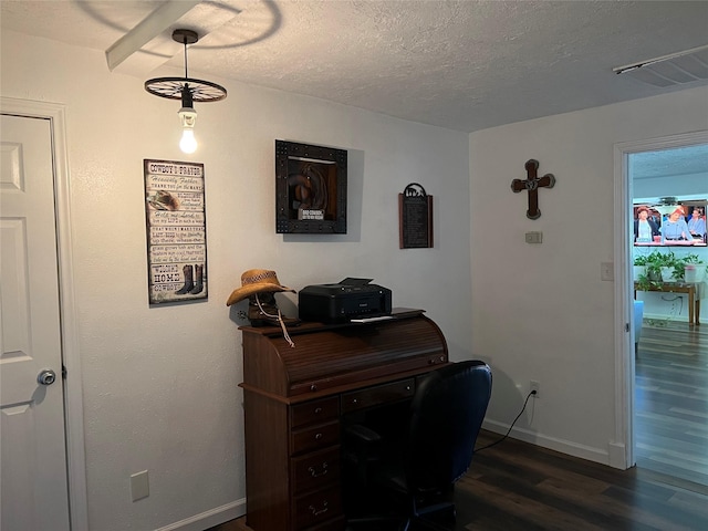 office area with a textured ceiling and dark hardwood / wood-style flooring