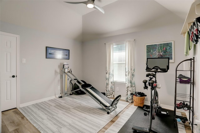 workout area with ceiling fan and light wood-type flooring