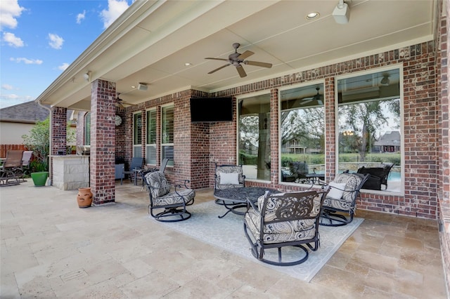 view of patio featuring ceiling fan