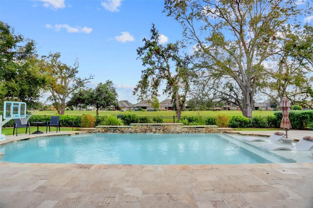 view of swimming pool featuring a patio