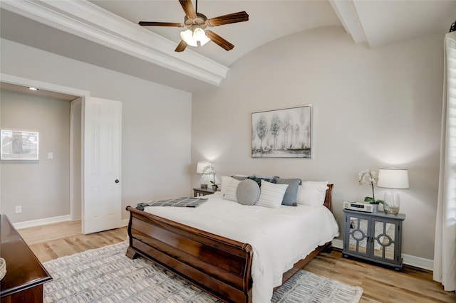 bedroom featuring ceiling fan, vaulted ceiling, and light hardwood / wood-style flooring