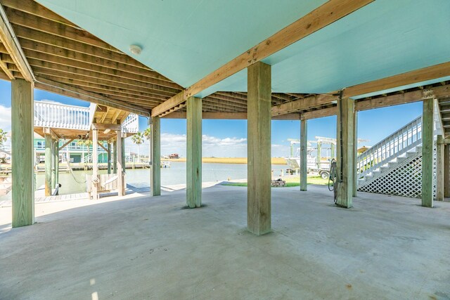 view of patio with a water view