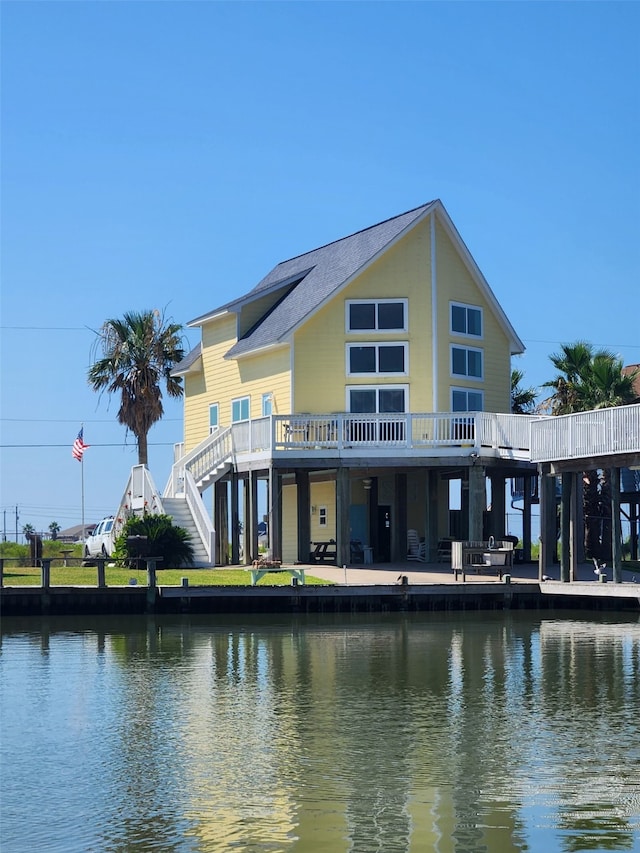 exterior space with a deck with water view