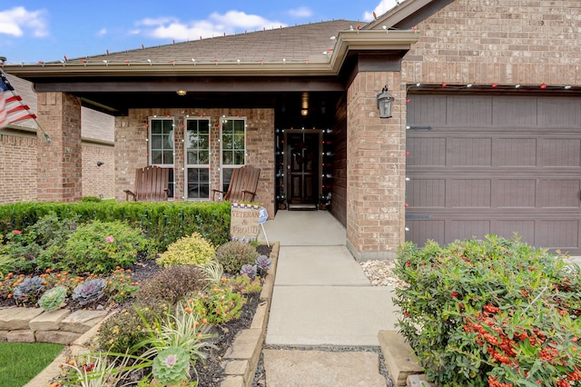 doorway to property featuring a garage