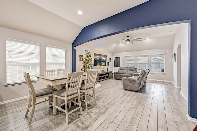 dining space with vaulted ceiling and ceiling fan