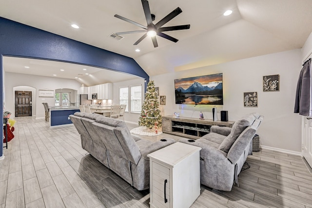 living room with vaulted ceiling and ceiling fan