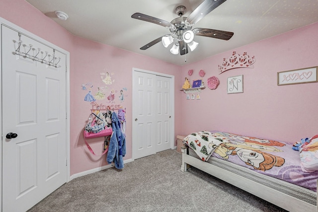 bedroom featuring ceiling fan, light colored carpet, and a closet