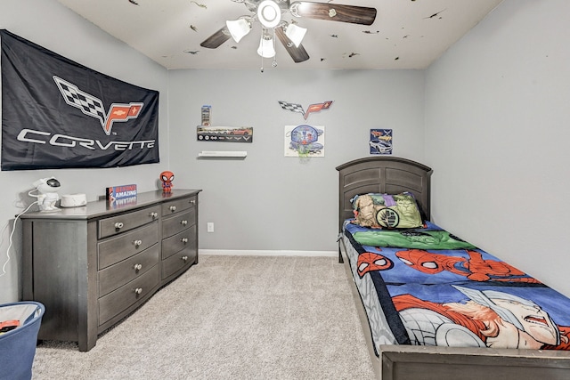 bedroom with ceiling fan and light carpet