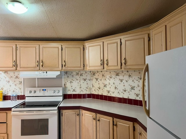 kitchen with light brown cabinetry and white appliances