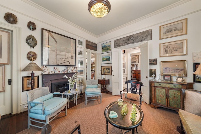 1107 Church St, Galveston, TX 77550 - living room featuring a fireplace, crown molding, and wood finished floors