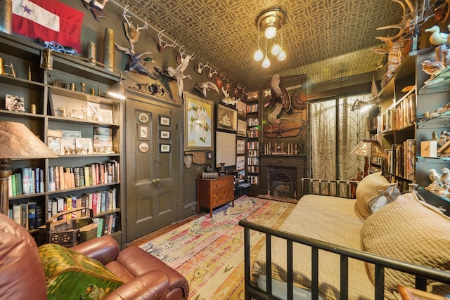 1107 Church St, Galveston, TX 77550 - bedroom featuring an ornate ceiling and wood finished floors
