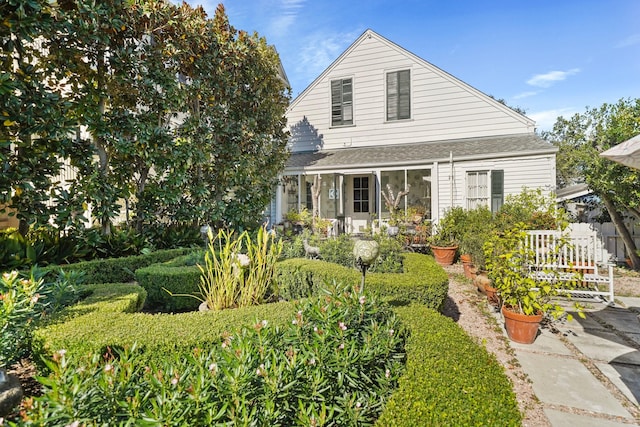 1107 Church St, Galveston, TX 77550 - view of front of home with a shingled roof