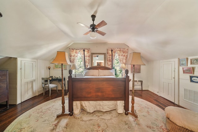 bedroom with ceiling fan, dark hardwood / wood-style flooring, and vaulted ceiling