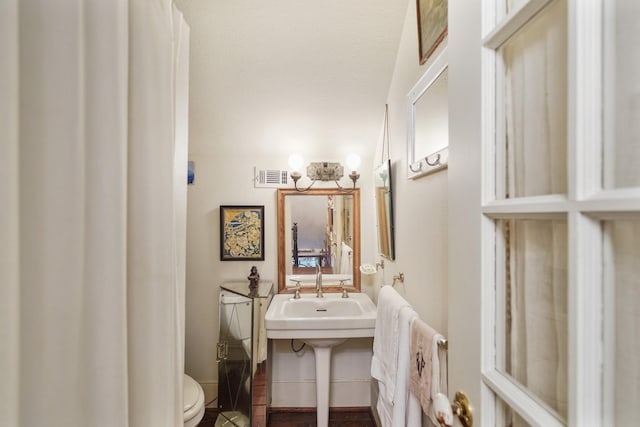 1107 Church St, Galveston, TX 77550 - bathroom featuring toilet and a sink