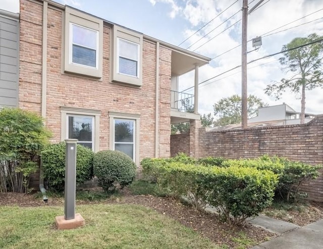 view of side of home featuring a yard