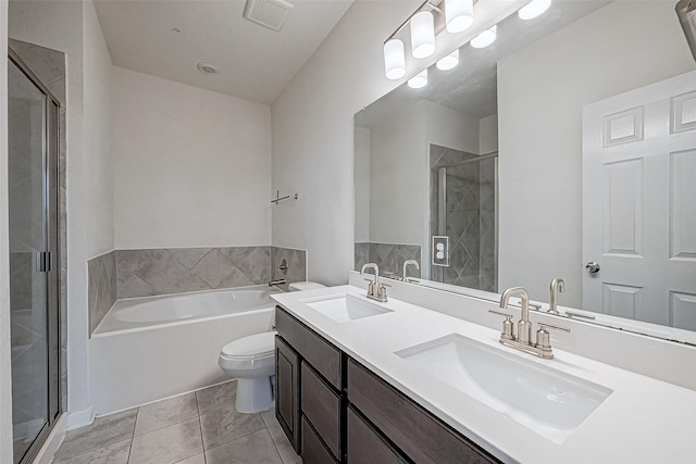 full bathroom with tile patterned flooring, vanity, separate shower and tub, and toilet