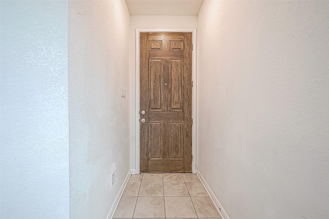 hallway with light tile patterned flooring