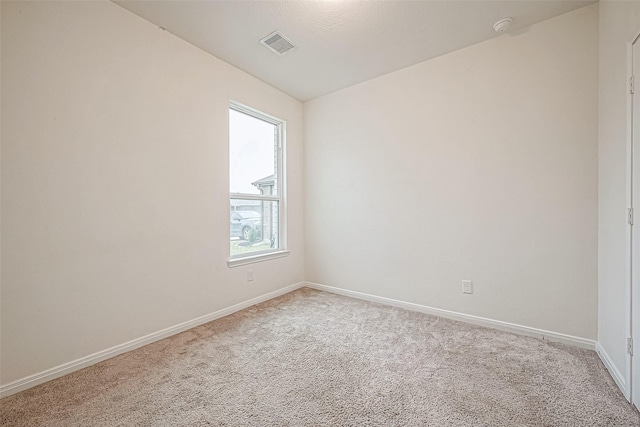 unfurnished room featuring carpet floors and a healthy amount of sunlight