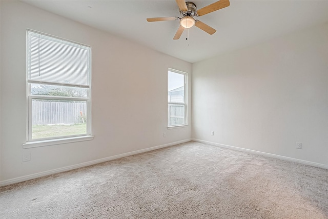 unfurnished room with carpet flooring and ceiling fan