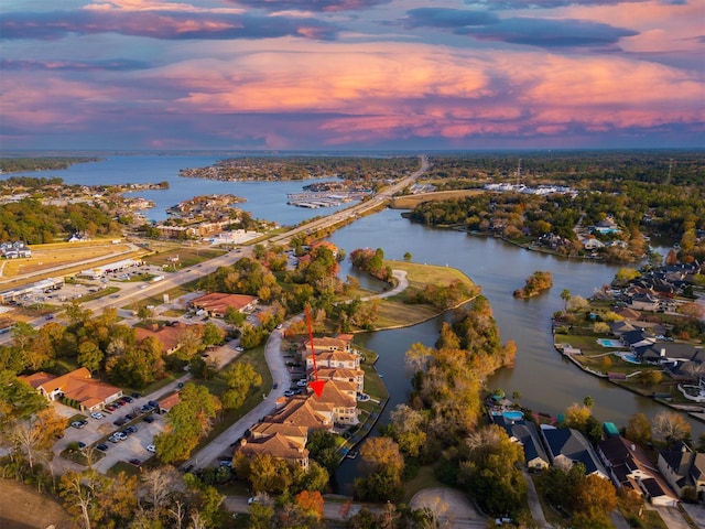 aerial view at dusk with a water view