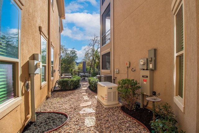 view of side of home featuring central air condition unit