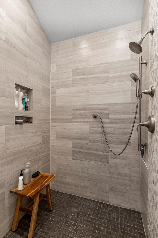 bathroom with a tile shower