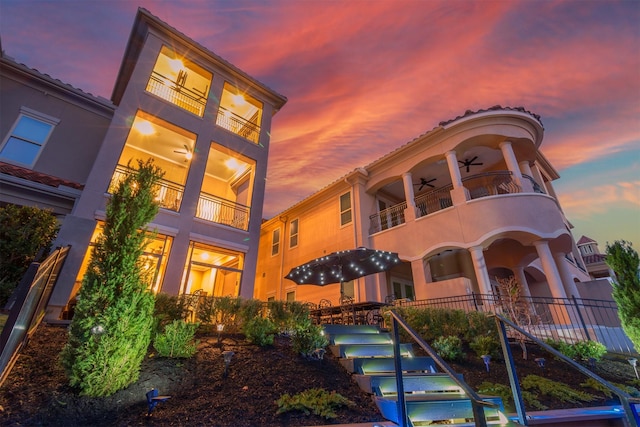 view of outdoor building at dusk