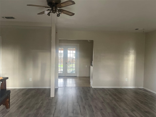 empty room featuring ceiling fan and dark wood-type flooring