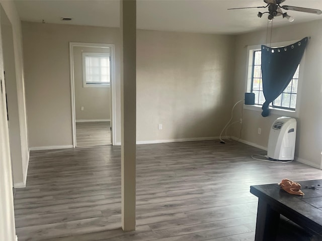 interior space featuring hardwood / wood-style floors and ceiling fan