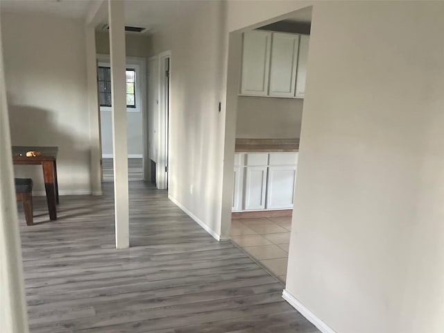 corridor featuring dark hardwood / wood-style floors