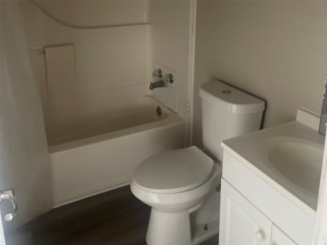 full bathroom featuring shower / bathing tub combination, vanity, toilet, and hardwood / wood-style floors