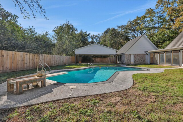 view of pool featuring a diving board, a yard, and a sunroom