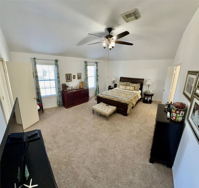 carpeted bedroom featuring ceiling fan and lofted ceiling