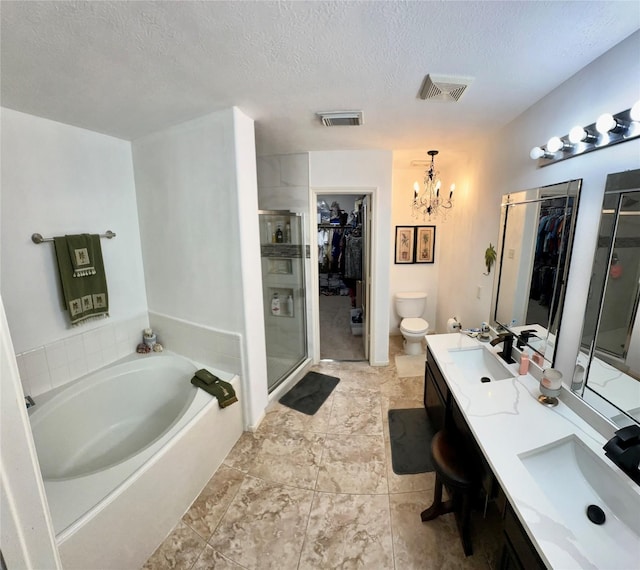 full bathroom with vanity, an inviting chandelier, toilet, shower with separate bathtub, and a textured ceiling