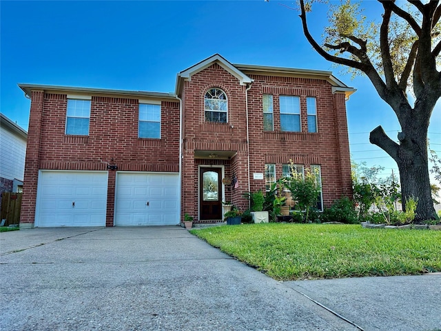 view of front of home featuring a garage and a front lawn