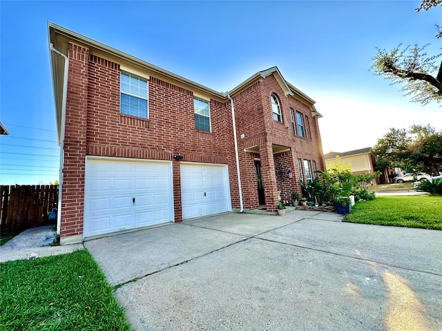 view of front of house with a garage and a front lawn