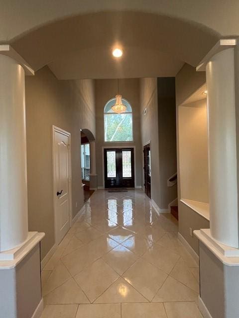 entrance foyer featuring a towering ceiling