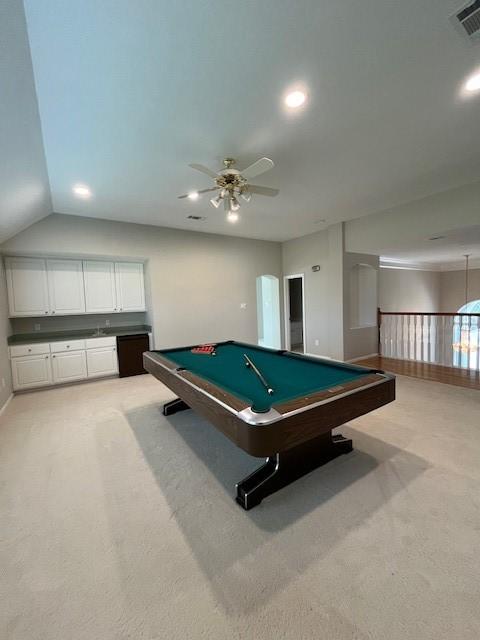 recreation room with light colored carpet, ceiling fan, lofted ceiling, and pool table