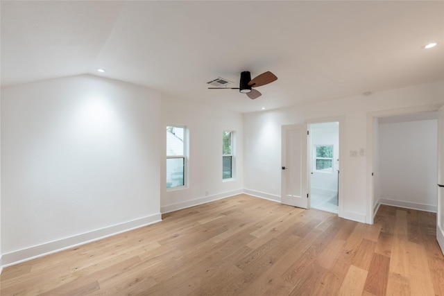 unfurnished room featuring ceiling fan, vaulted ceiling, and light hardwood / wood-style flooring