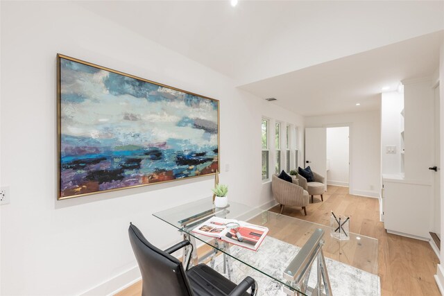 dining space featuring light wood-type flooring