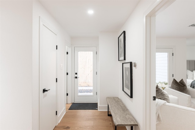 hallway featuring light hardwood / wood-style flooring