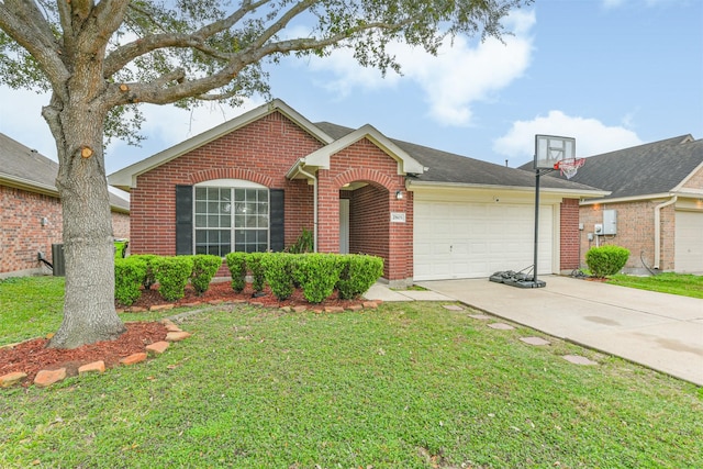 single story home with a front yard and a garage