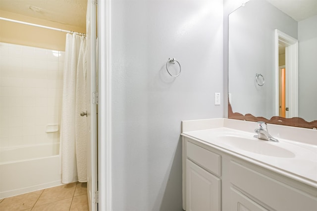 bathroom with tile patterned floors, vanity, and shower / bath combo