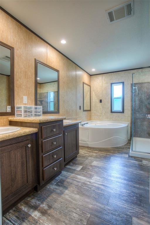 bathroom with shower with separate bathtub, vanity, and hardwood / wood-style flooring