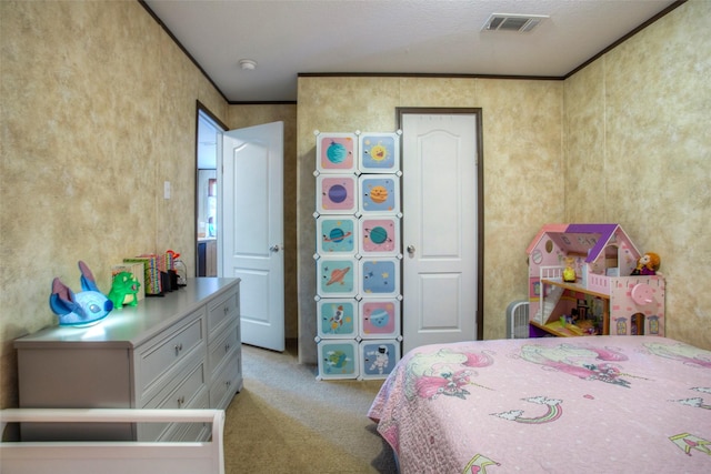 bedroom with carpet floors and a textured ceiling