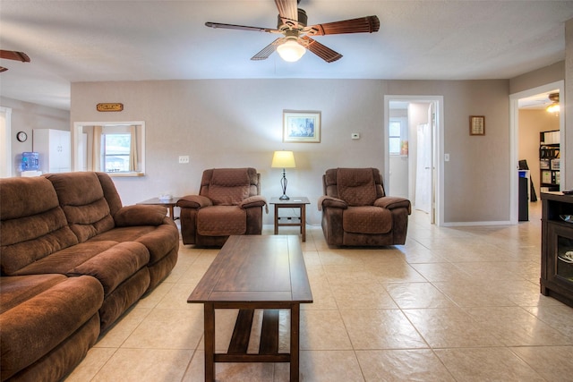 living room featuring ceiling fan and light tile patterned floors