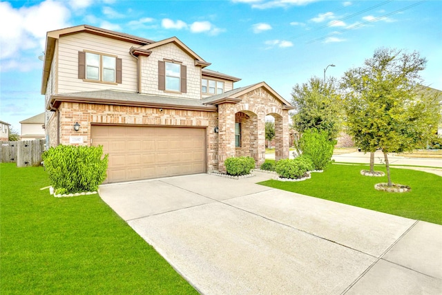 view of front of property featuring a front yard and a garage