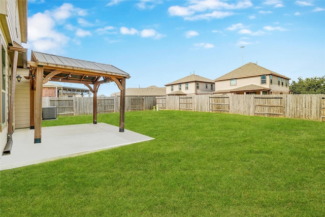 view of yard with a patio area and central AC